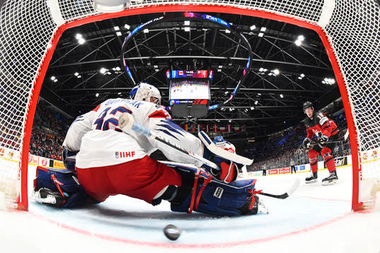 Goaltender Patrik Bartosak of Czech Republic lets in the