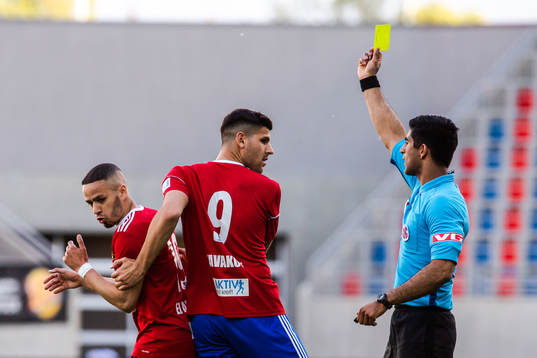 Ahmed El-Amrani of Skeid receives a yellow card  a