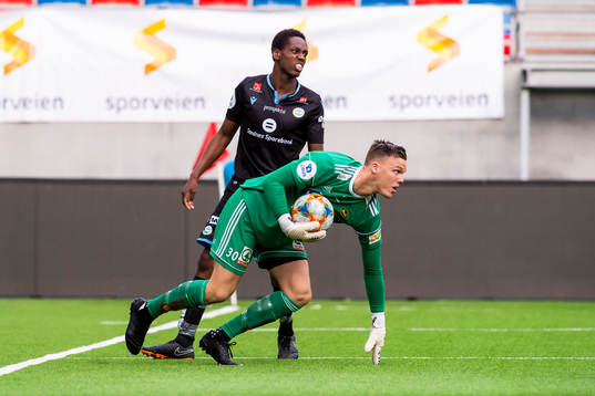 Akinsola Akinyemi of Sandnes Ulf  and goalkeeper Idar