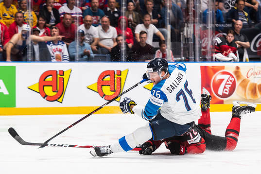 Jere Sallinen of Finland and Thomas Chabot of Canada
