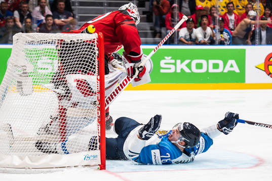 Goaltender Matt Murray of Canada and Jere Sallinen of