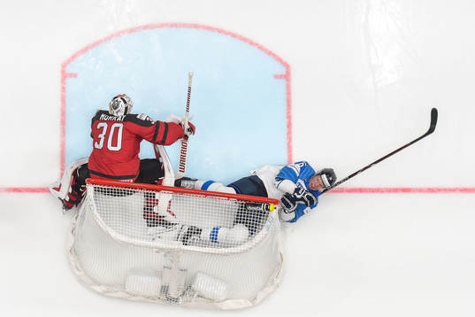 Goaltender Matt Murray of Canada and Jere Sallinen of