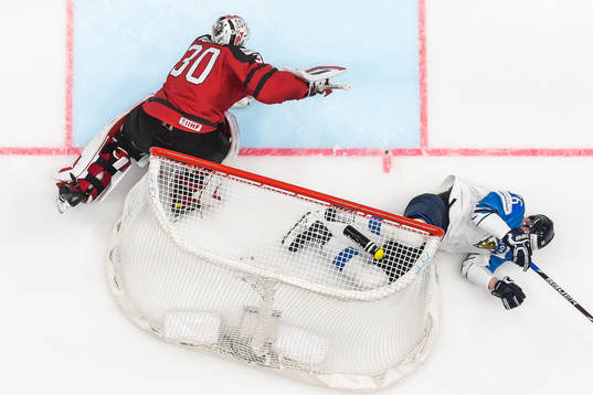 Goaltender Matt Murray of Canada and Jere Sallinen of