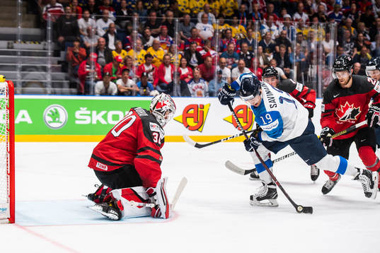 Veli-Matti Savinainen of Finland and goaltender Matt Murray