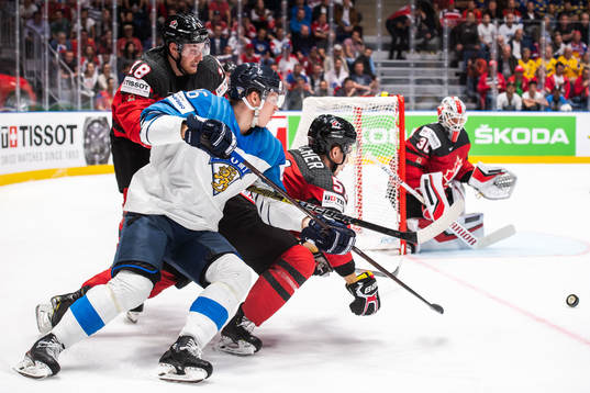 Jere Sallinen of Finland against Pierre-Luc Dubois and Troy