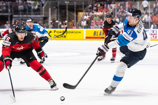 Jared McCann of Canada and Joel Kiviranta of Finland