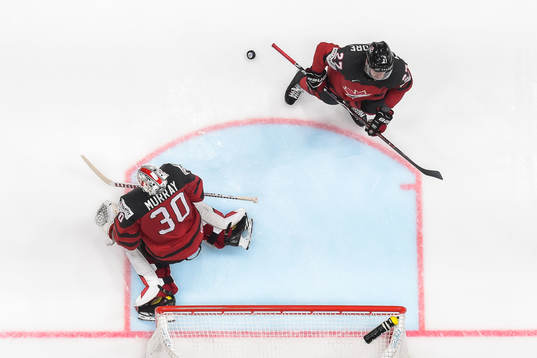 Goaltender Matt Murray and Shea Theodore of Canada look