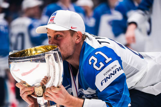 Juhani Tyrväinen of Finland celebrates with the trophy