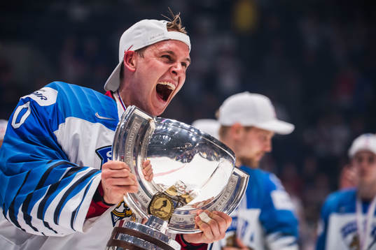 Goaltender Kevin Lankinen of Finland celebrates with the