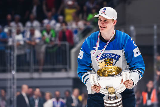 Kaapo Kakko of Finland celebrates with the trophy