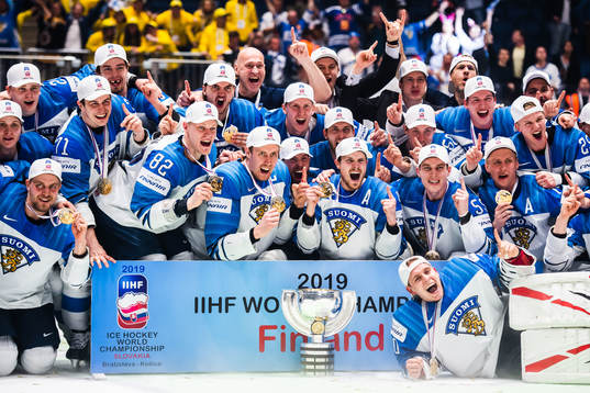 Players of Finland celebrates with the trophy