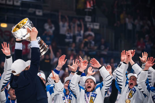 Players of Finland celebrates with the trophy