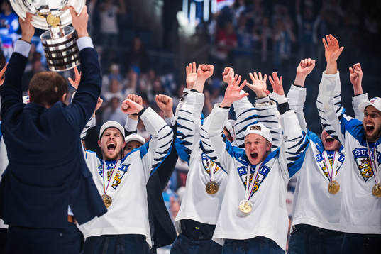Players of Finland celebrates with the trophy