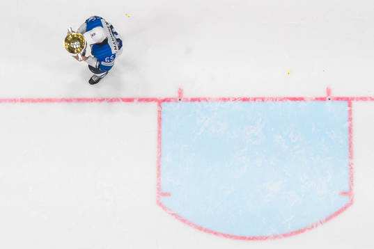 Sakari Manninen of Finland celebrates with the trophy