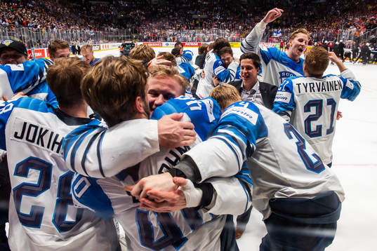 Henri Jokiharju and Juhani Tyrväinen of Finland celebrate