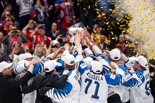 Players of Finland celebrate with the trophy