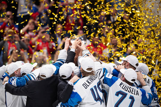Players of Finland celebrate with the trophy