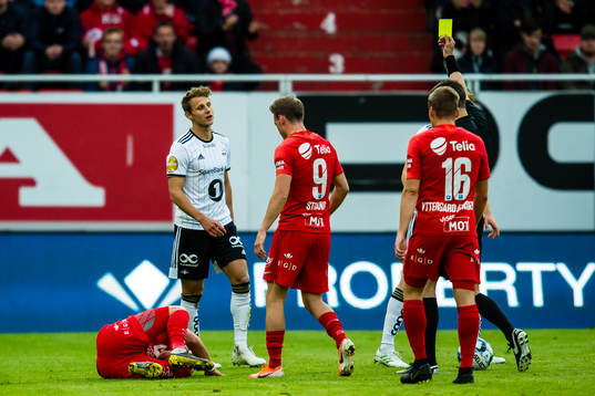 Vegar Eggen Hedenstad of Rosenborg gets a yellow card by