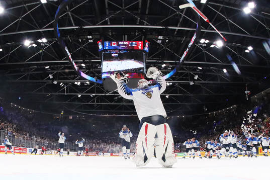 Goaltender Kevin Lankinen of Finland celebrates his team's