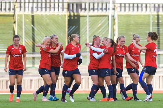 Therese Sessy Åsland of Norway celebrate with teammates