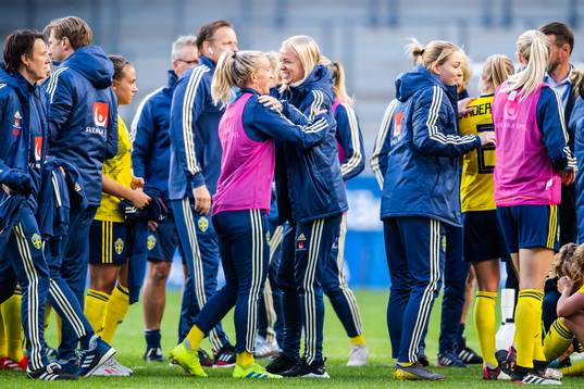 Caroline Seger and Julia Roddar of Sweden celebrate