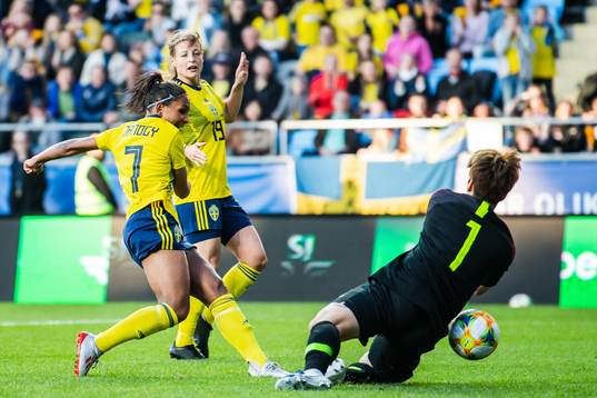 Madelen Janogy of Sweden scores 1-0 behind goalkeeper Gaae