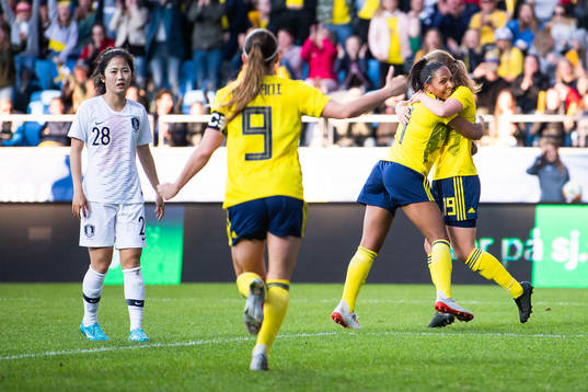 Mina Lee of South Korea looks dejected while Madelen Janogy