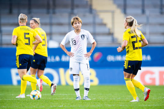 Minji Yeo of South Korea looks dejected