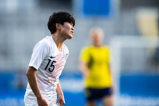 Youngju Lee of South Korea looks dejected
