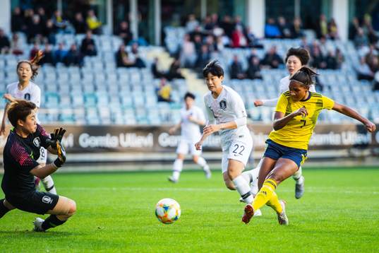 Madelen Janogy of Sweden scores 1-0 behind goalkeeper Gaae