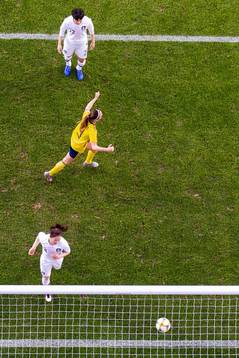 Kosovare Asllani of Sweden celebrates while Hwayeon Son and