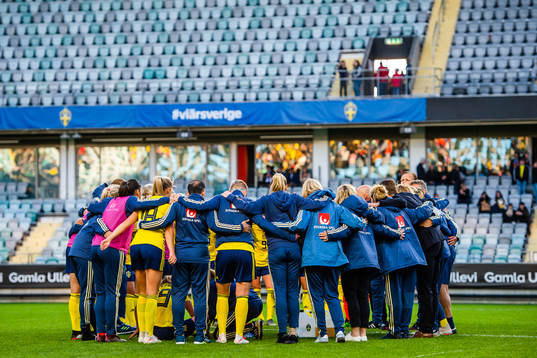 Players and staff gathered