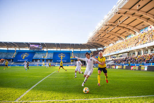 Doyeon Kim of South Korea   and Stina Blackstenius of Sweden