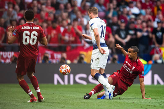 Harry Kane of Tottenham and Joel Matip of Liverpool