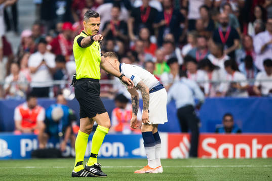Referee Damir Skomina calls a penalty for Liverpool