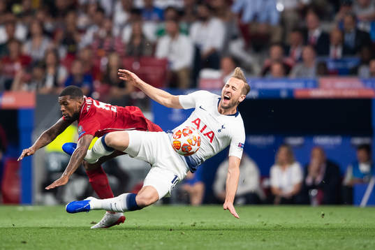 Georginio Wijnaldum of Liverpool and Harry Kane of