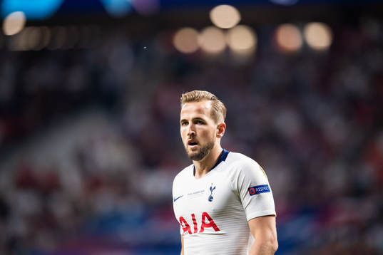 Harry Kane of Tottenham compete for the ball