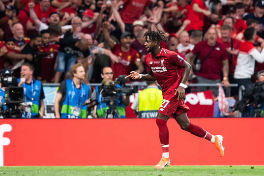 Divock Origi of Liverpool celebrates scoring 0-2