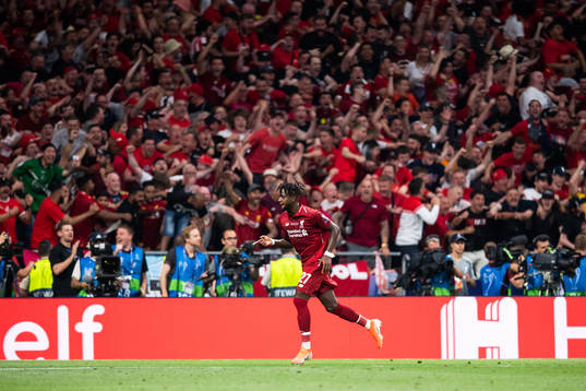 Divock Origi of Liverpool celebrates scoring 0-2