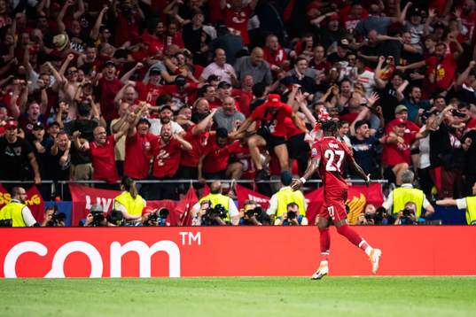 Divock Origi of Liverpool celebrates scoring 0-2