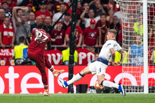 Divock Origi of Liverpool scores 0-2 behind goalkeeper Hugo