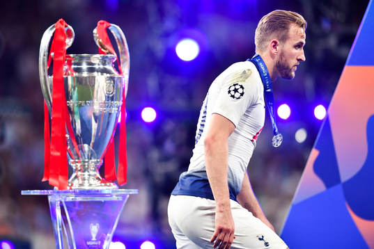 Harry Kane of Tottenham looks dejected as he walks past the