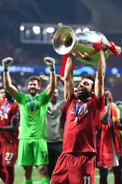 Mohamed Salah of Liverpool celebrates with the throphy