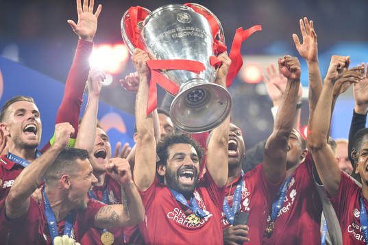 Mohamed Salah of Liverpool raises the throphy in front of