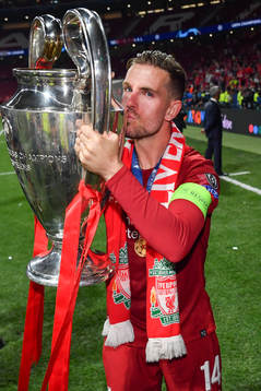 Jordan Henderson of Liverpool celebrate with the trophy