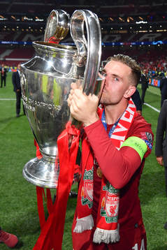 Jordan Henderson of Liverpool celebrate with the trophy