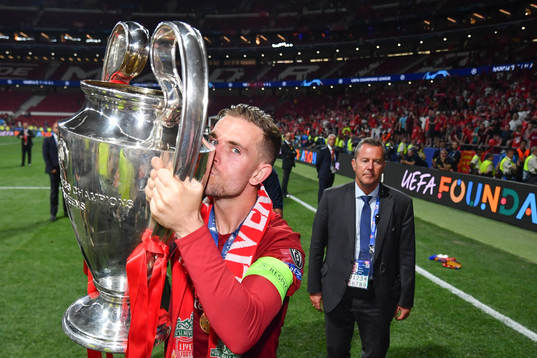 Jordan Henderson of Liverpool celebrate with the trophy