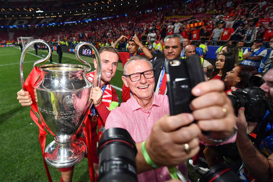 Jordan Henderson of Liverpool celebrate with the trophy and