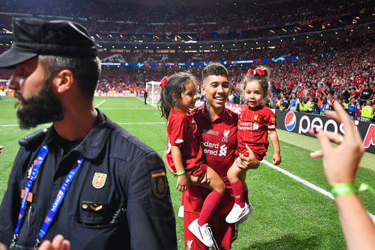 Roberto Firmino of Liverpool celebrates with his children