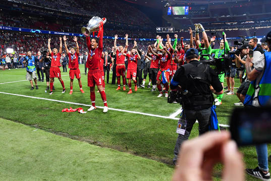 Virgil van Dijk of Liverpool celebrate with the trophy
